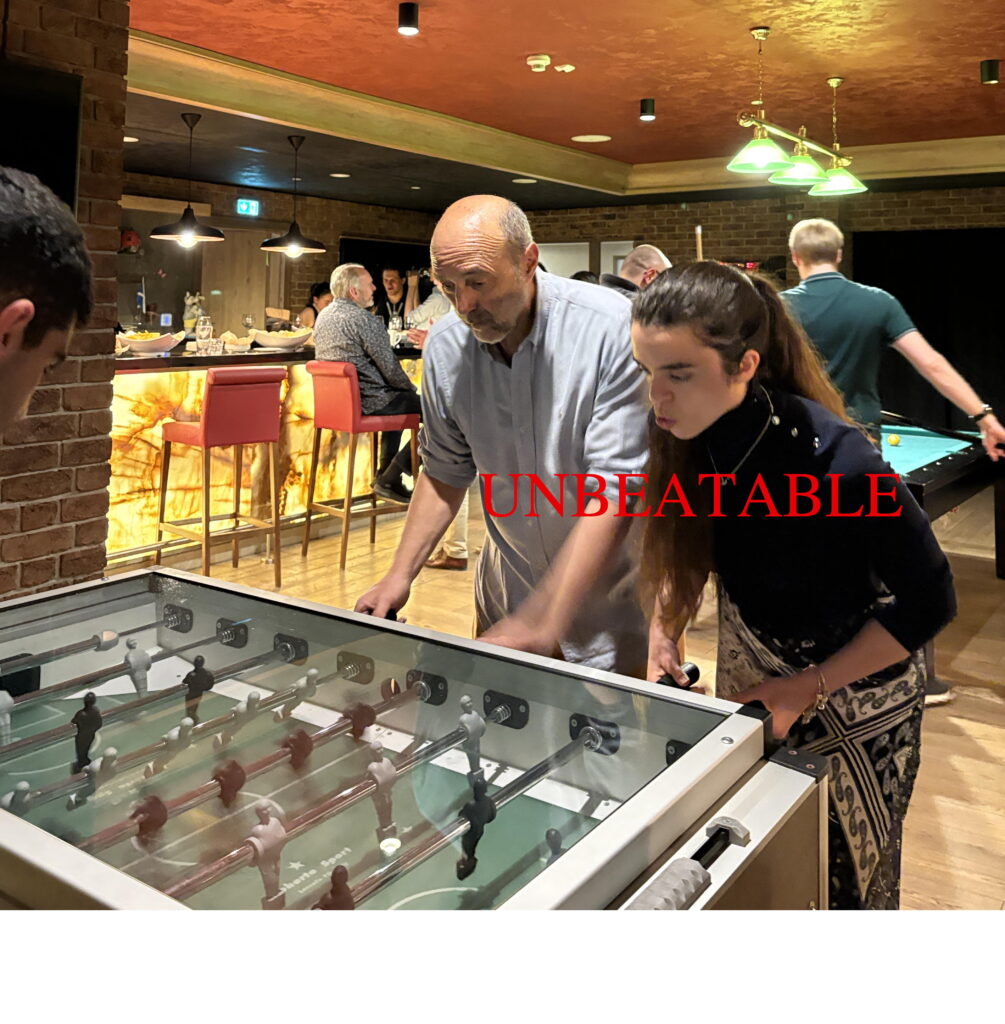 Social programme: two people playing table soccer.